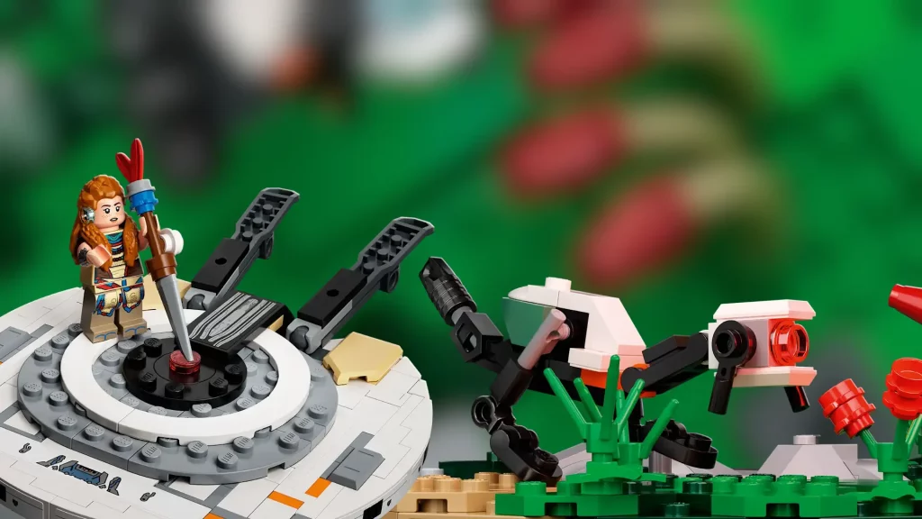 Le set LEGO Horizon Forbidden West : Grand-cou inclus une minifigure d'Aloy et un petit veilleur à assembler.